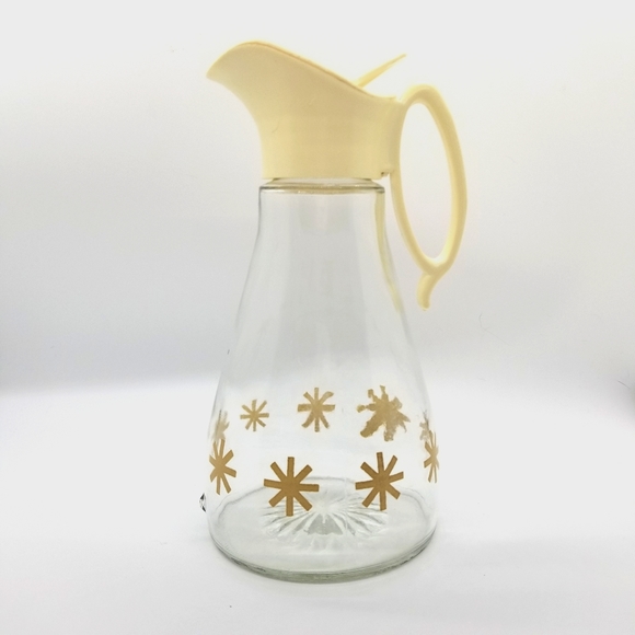 Mid Century Glass Syrup With a Starburst Pattern.